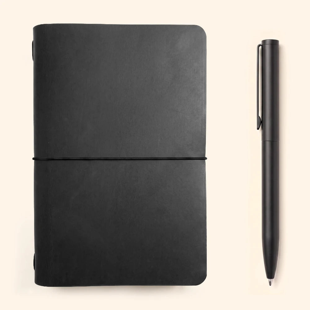 Durable natural leather journal sleeve with flexible elastic support and blank pages.