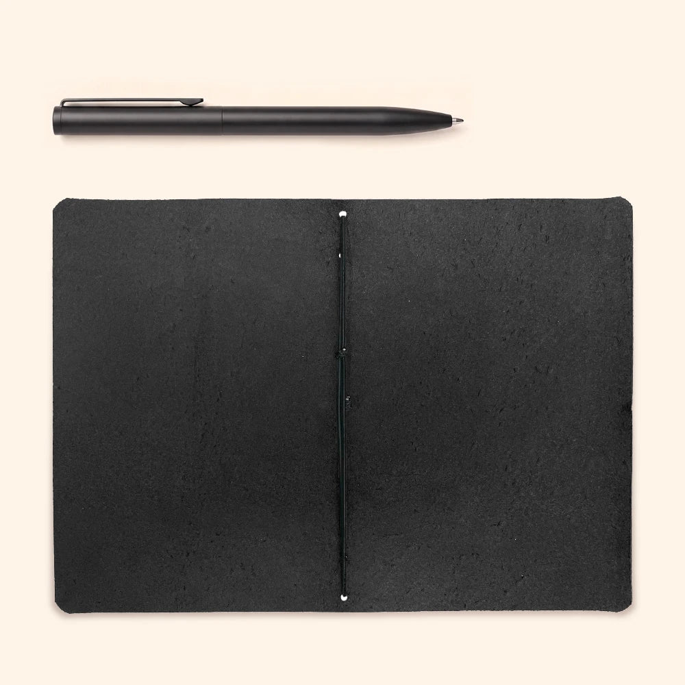 Handmade journal cover crafted from genuine leather with a plain notebook insert.