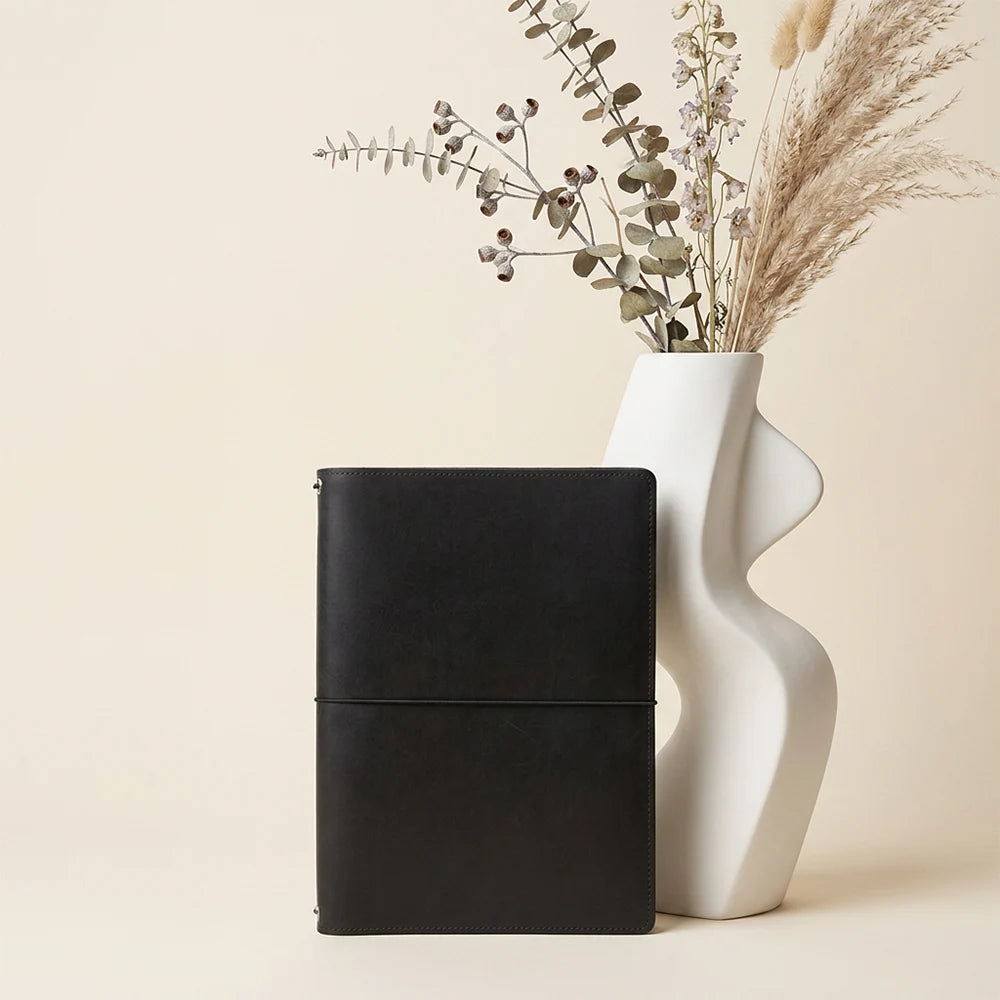 Handmade journal organizer crafted for multiple inserts, notes, and drawing materials.