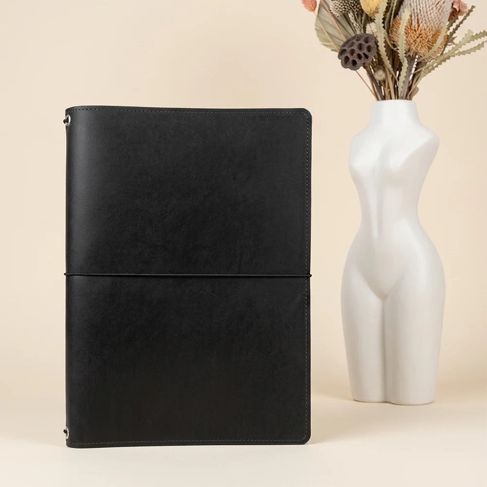 Genuine leather notebook case with flexible loops and practical document pockets.