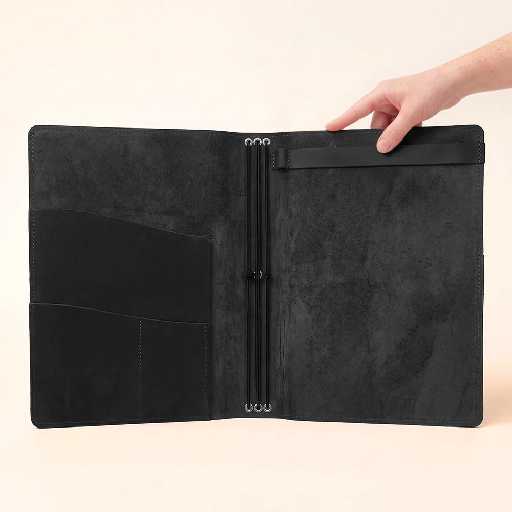 Leather organizer cover featuring an adaptable interior for journaling and sketching supplies.