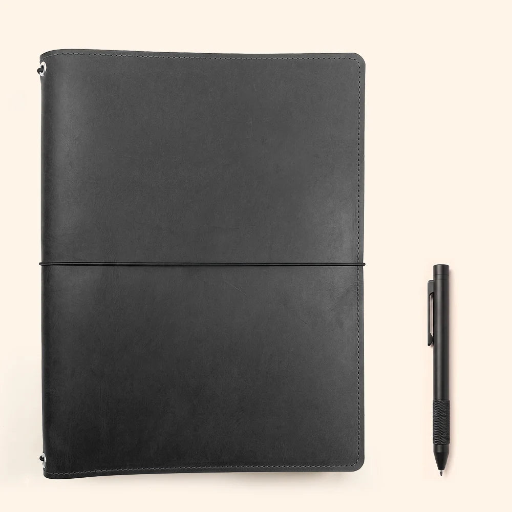 Handmade leather notebook wrap with three elastic cords and integrated storage pockets.