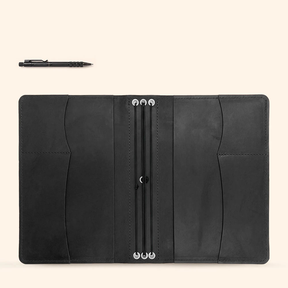Leather notebook cover handcrafted with functional organizer sleeves and elegant pen keeper.