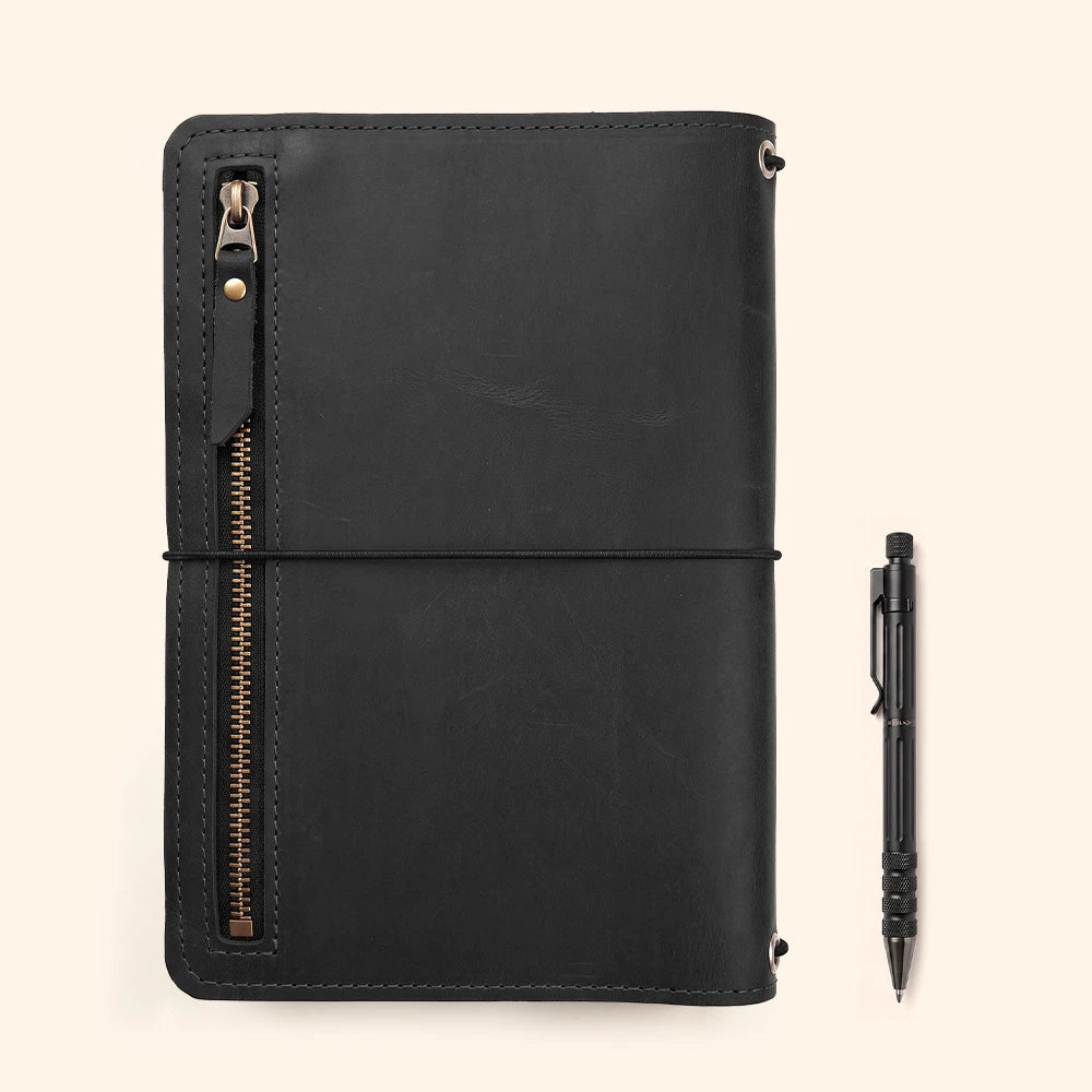 Genuine leather journal portfolio with refined interior organization and practical pen storage.