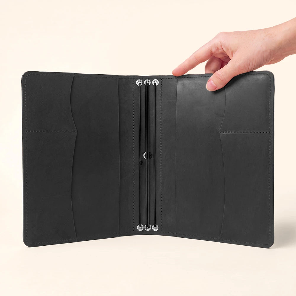 Refillable notebook cover combining elegant leather craftsmanship with organized interior storage.