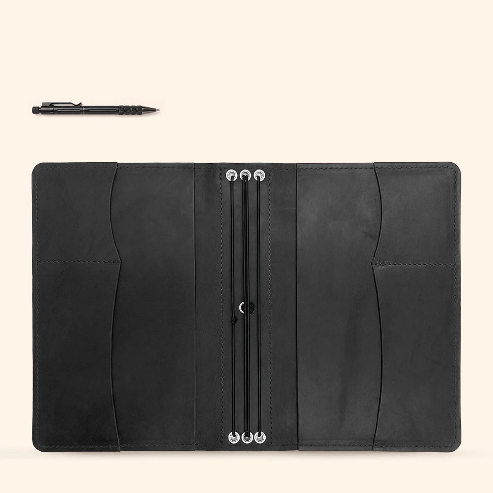 Handmade journal portfolio with organized interior sleeves and leather writing tool holder.