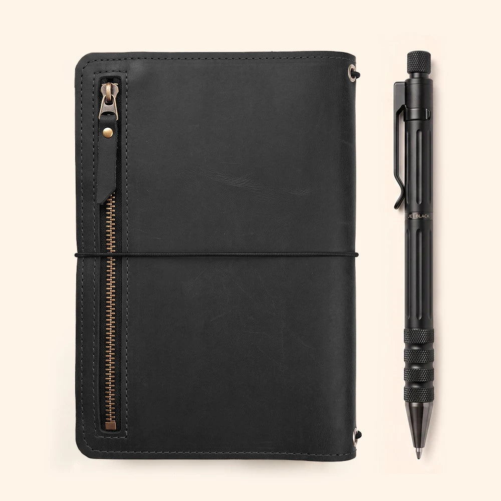 Leather notebook cover crafted from genuine leather with interior organizers and built-in pen loop.