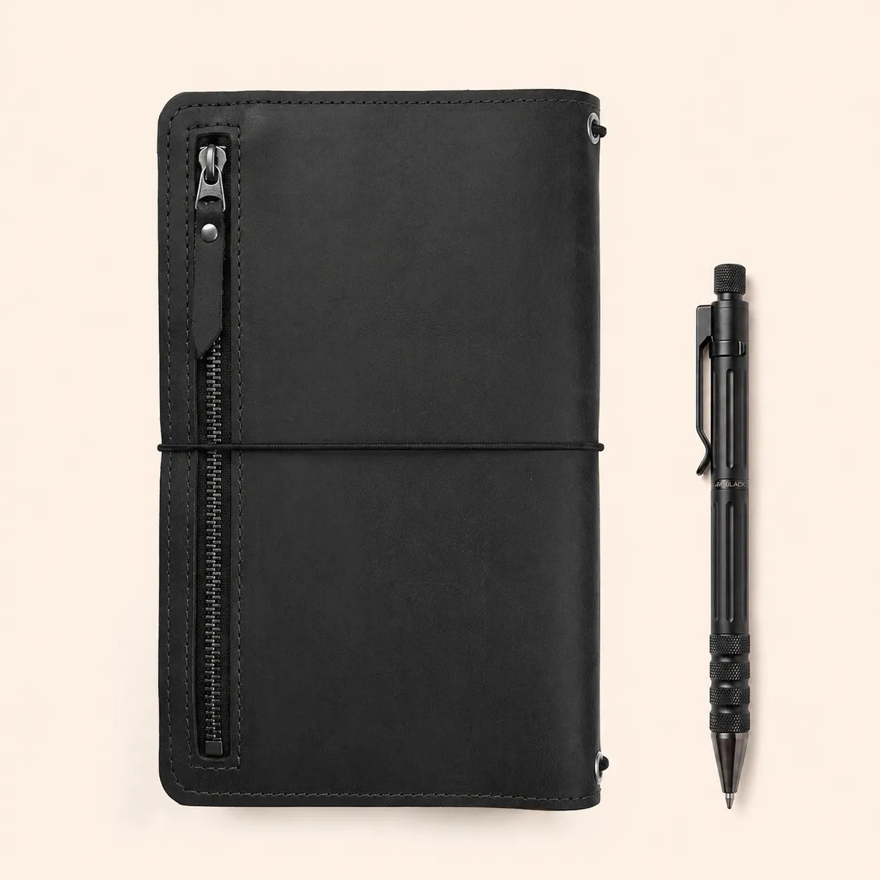 Leather notebook cover with dedicated compartments for organized writing accessories.