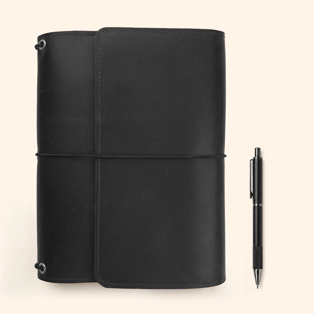 Handmade full grain leather notebook cover with interior organizer pockets and classic leather pen loop.