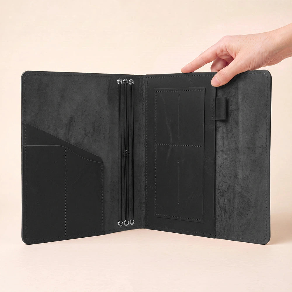 Leather notebook wallet organizer featuring spacious storage and secure stitched pen attachment.