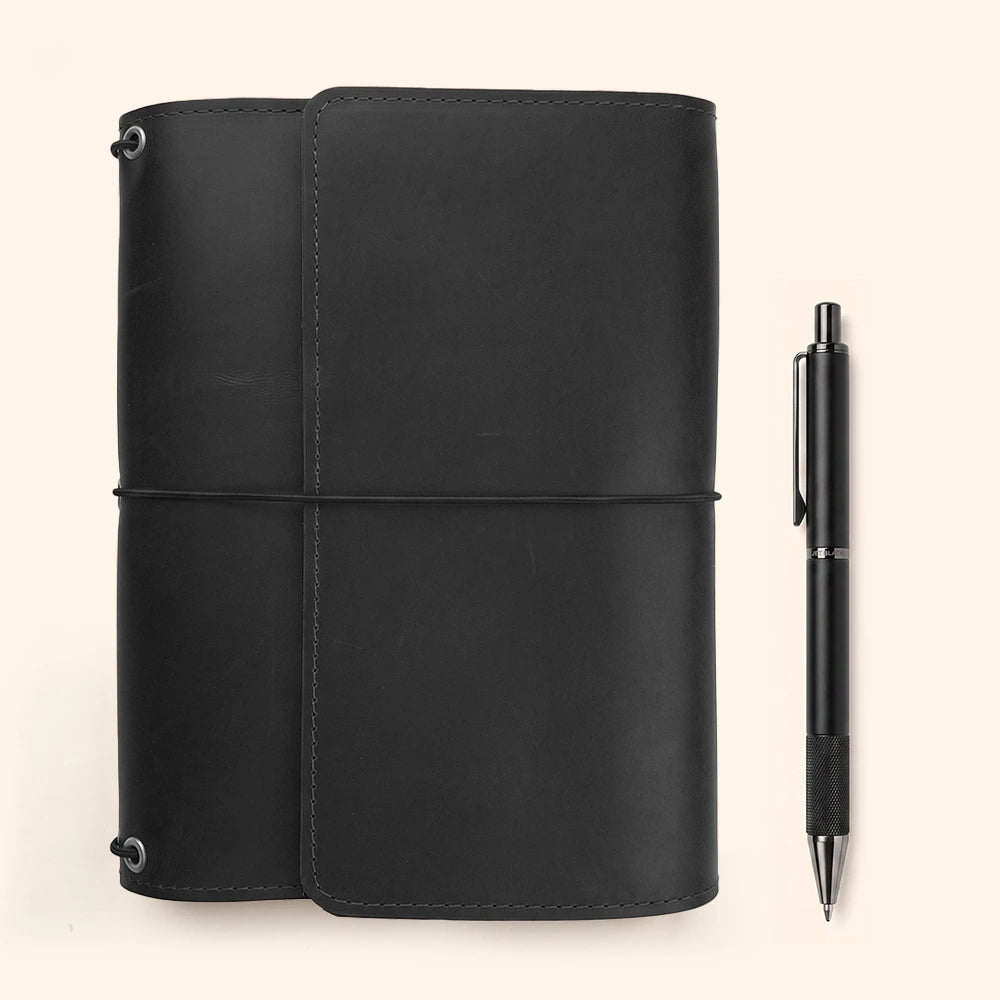 Natural leather notebook cover with refined organizer pockets and leather pen carrying strap.