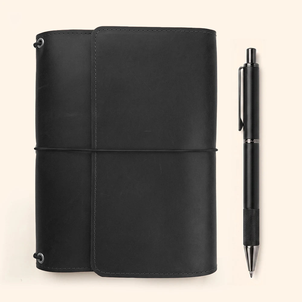 Full grain leather notebook organizer with interior document storage and pen carrying strap.
