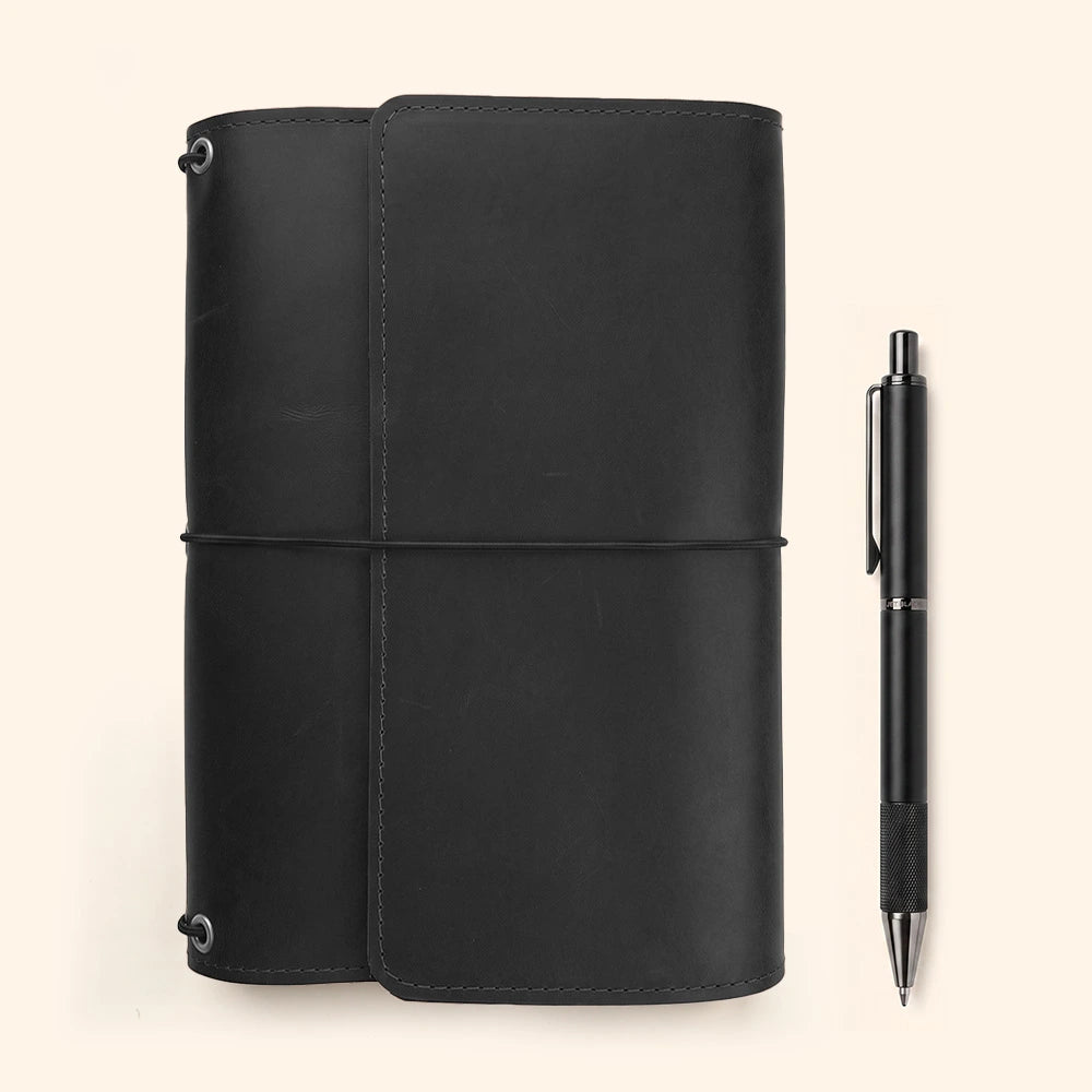 Leather notebook case crafted from natural leather with organized storage and pen attachment.