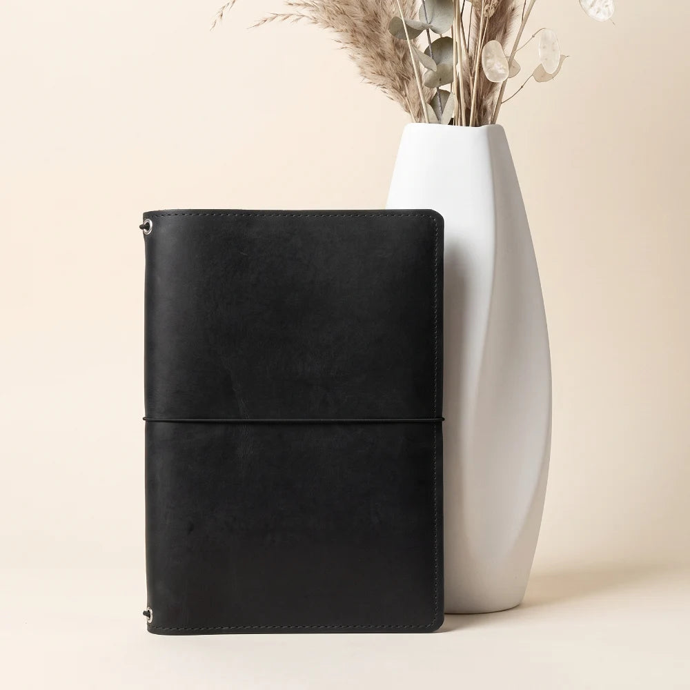 Natural leather cover with triple elastic attachments for a versatile journal system.