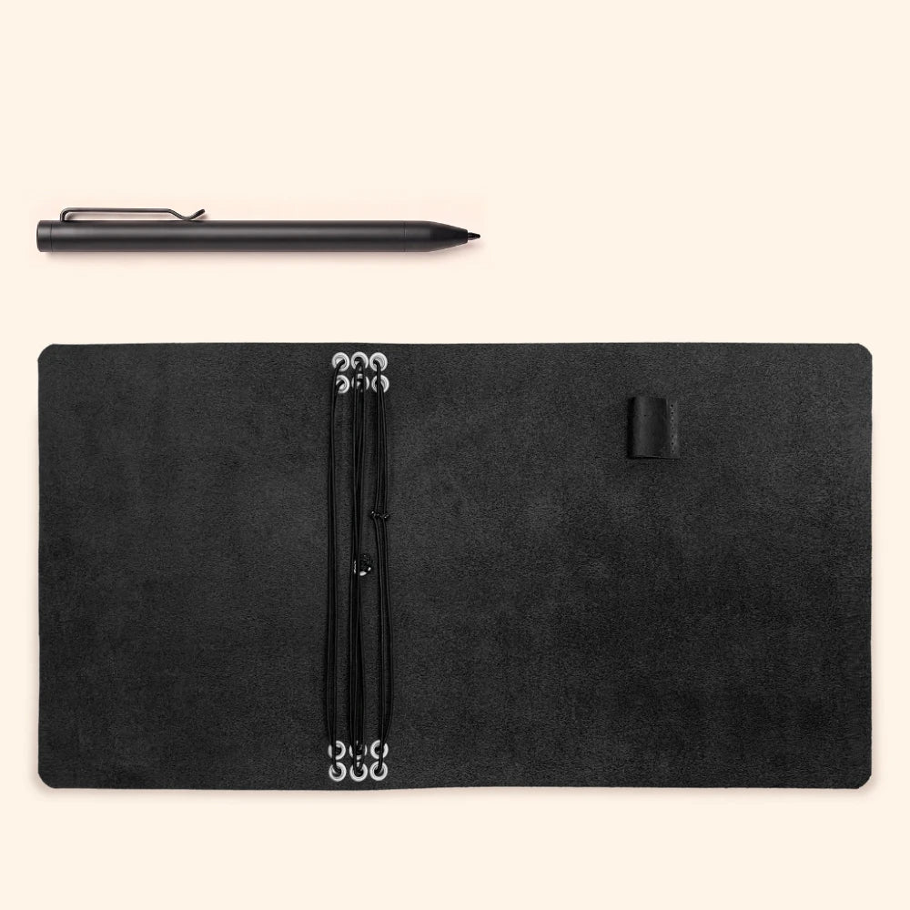 Refillable leather journal organizer with six elastic bands for multiple notebook inserts.