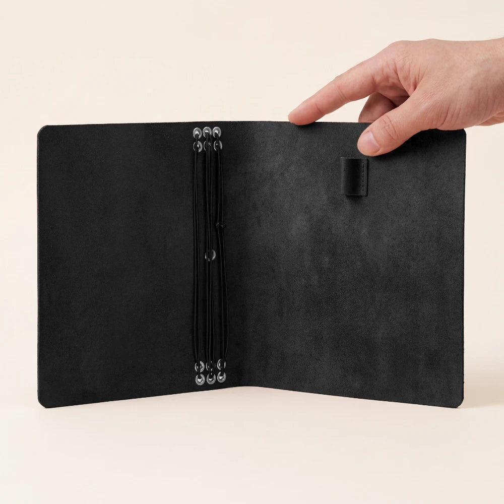 Functional leather journal case with six elastic straps and a dedicated pen loop.