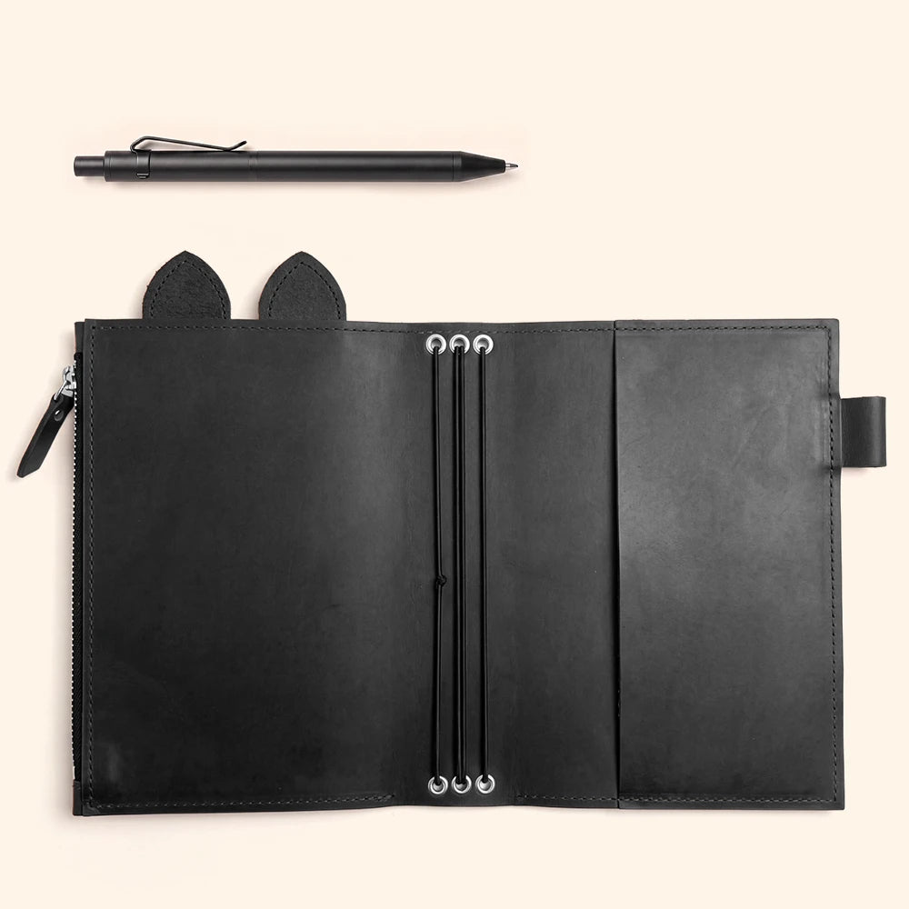 Genuine leather notebook cover with functional organization and charming handmade decorative details.