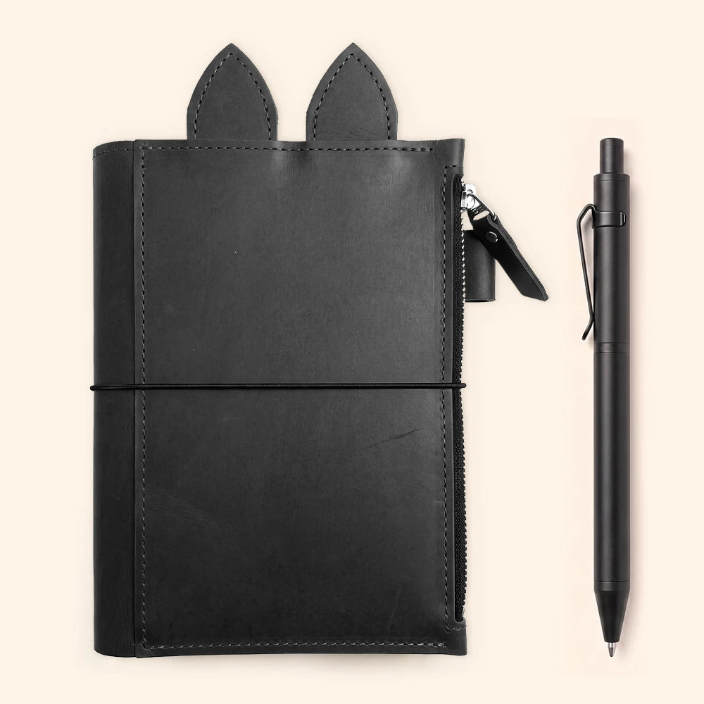 Genuine leather journal cover with internal zip compartment, pen loop, leather ears, and elastic bands.