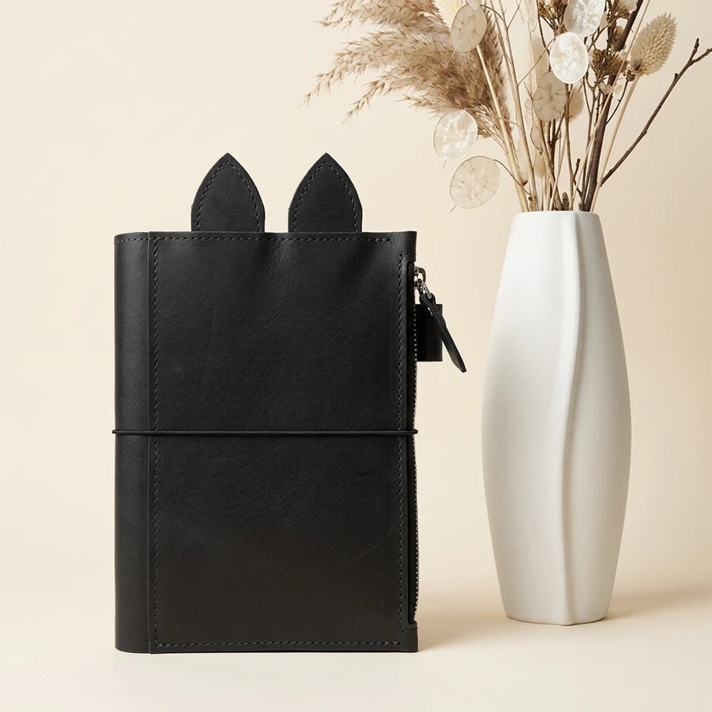 Genuine leather organizer cover with practical zip pocket, pen holder, leather ears, and three bands.