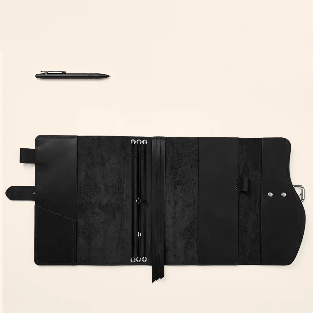 Natural leather journal case featuring organized compartments, pen loop, attached ribbon bookmark, and outside grip.