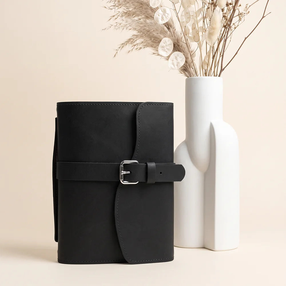 Handmade notebook carrier with genuine leather pockets, pen loop, page marker, and durable external handle.