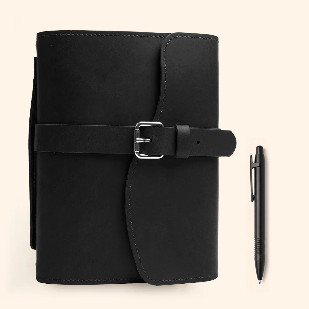 Premium natural leather notebook sleeve with inner compartments, pen loop, attached marker, and practical handle.