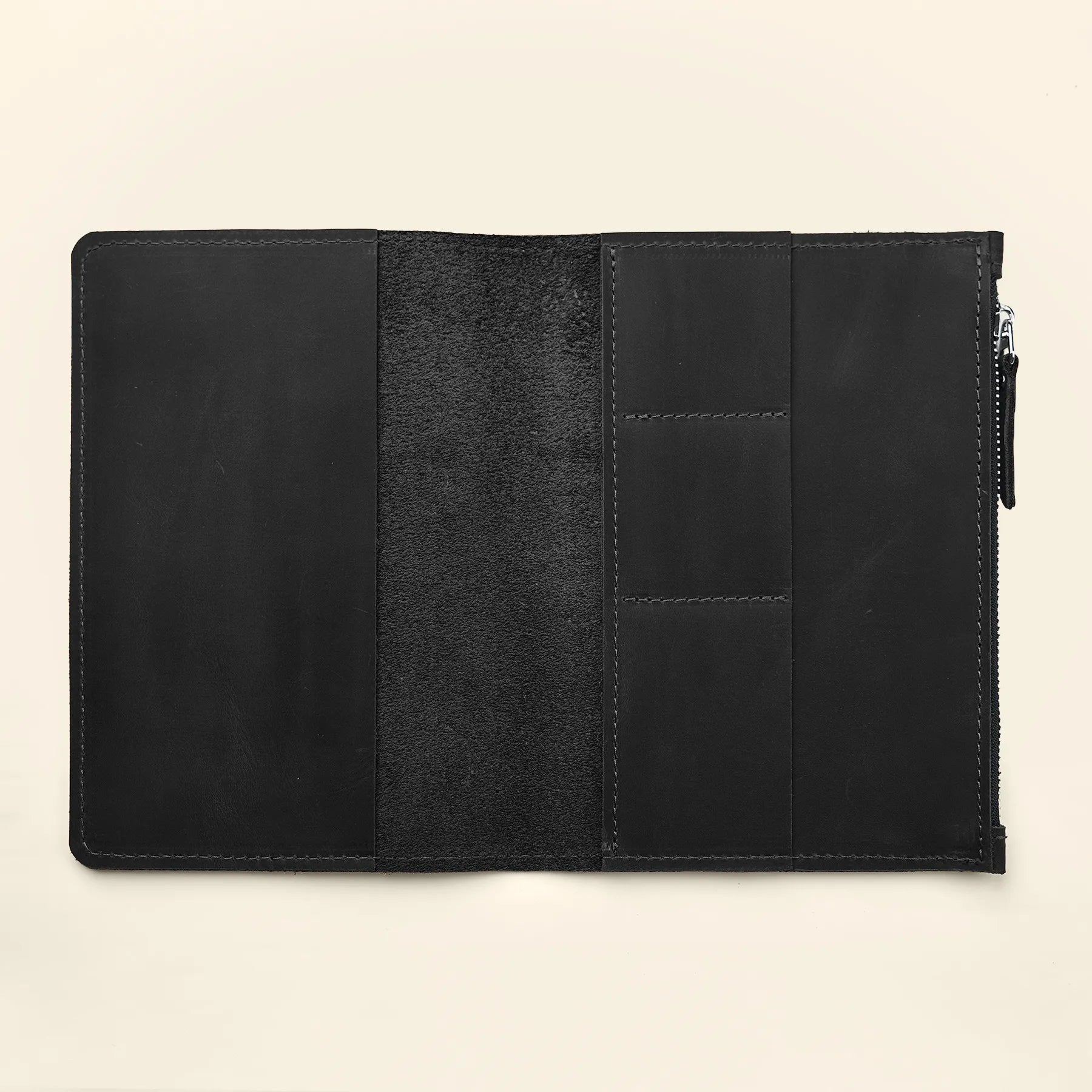 Refillable genuine leather notebook organizer insert with secure pocket storage design.