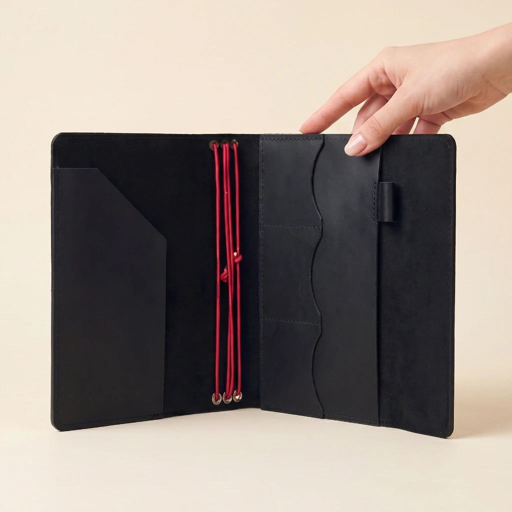 Leather notebook cover with refillable design, elastic bands, and organizer pockets