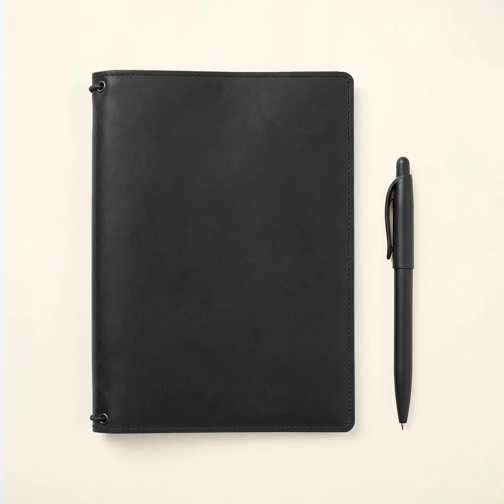 Leather notebook folio with secure interior layout for daily essentials.