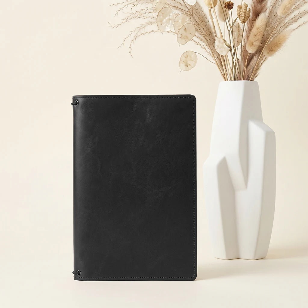 Leather planner organizer featuring refillable inserts and practical pocket layout.