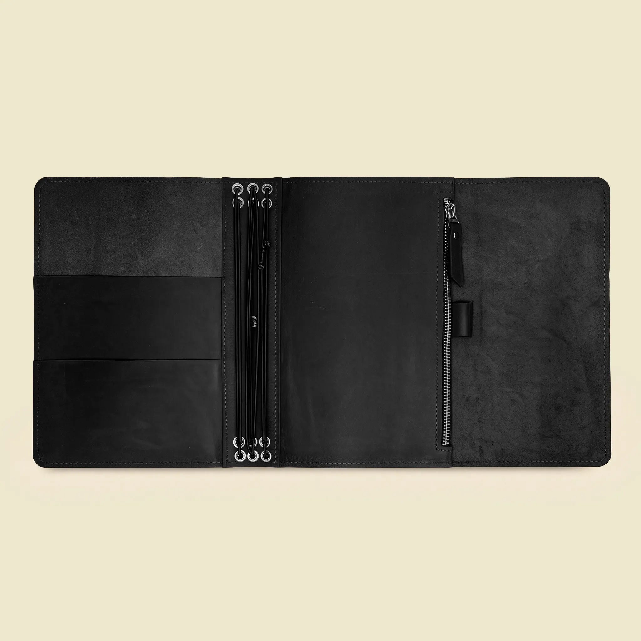Handmade leather cover designed to securely organize refill inserts and loose notes.