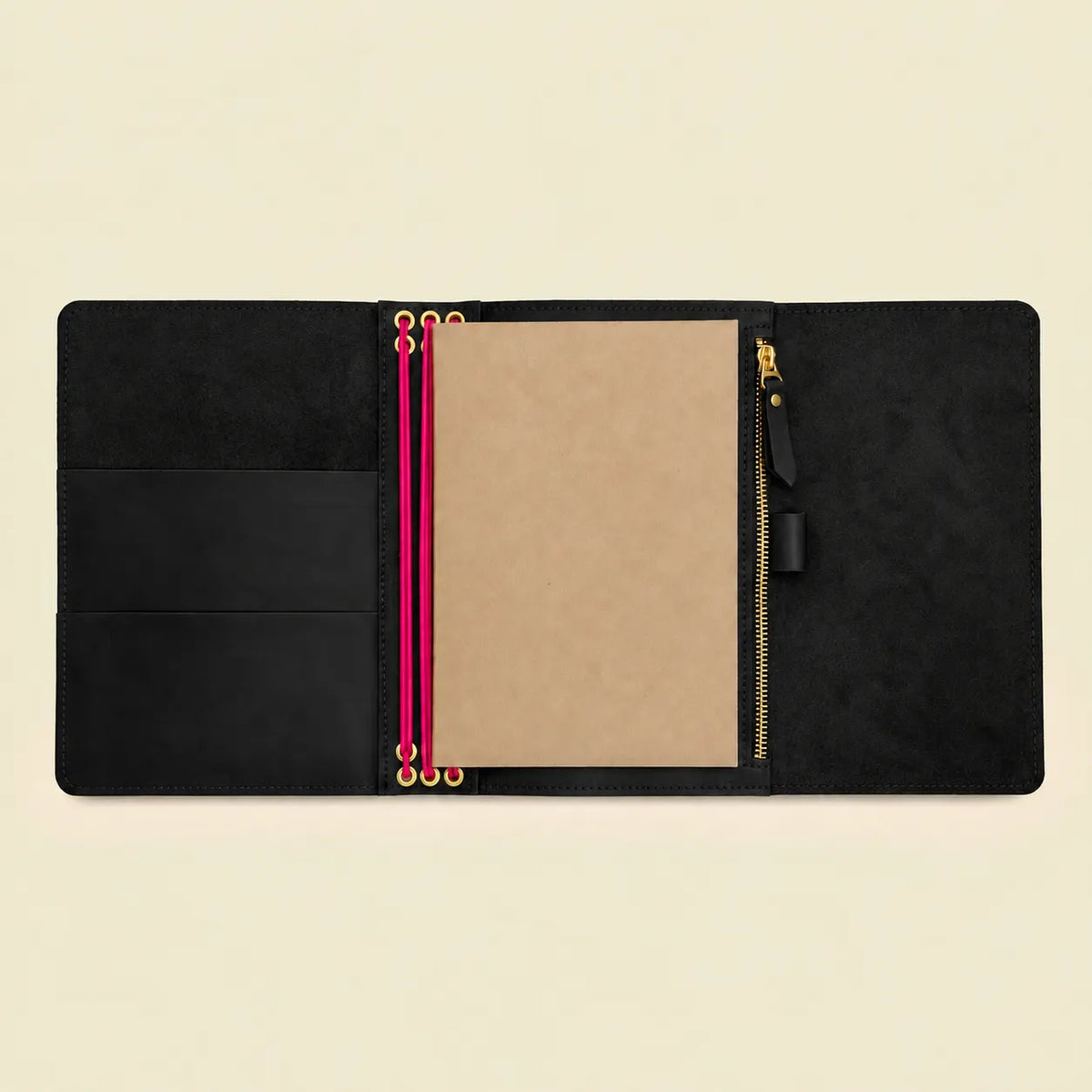 Natural leather notebook cover in black with contrasting pink elastic bands