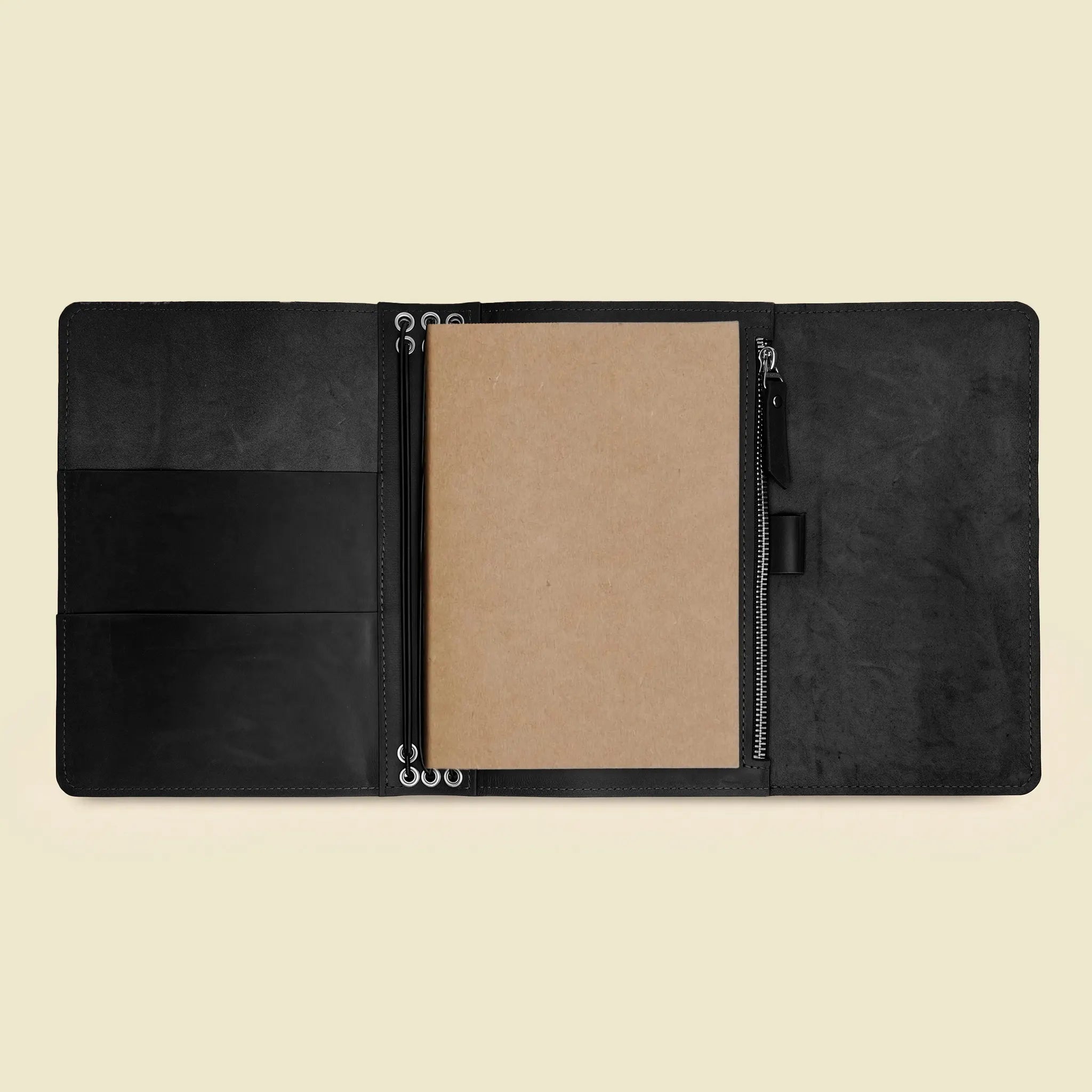 Open genuine leather writing case designed to keep notebooks and small items organized.