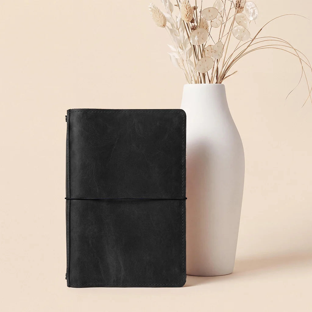 Genuine leather journal cover designed for refillable notebook inserts and organized storage.