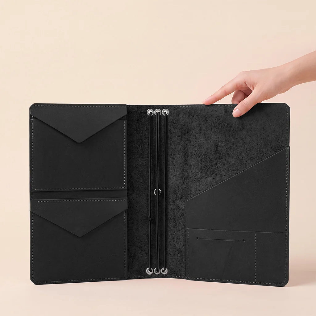 Leather notebook cover with premium organizer layout and flexible elastic notebook retention.