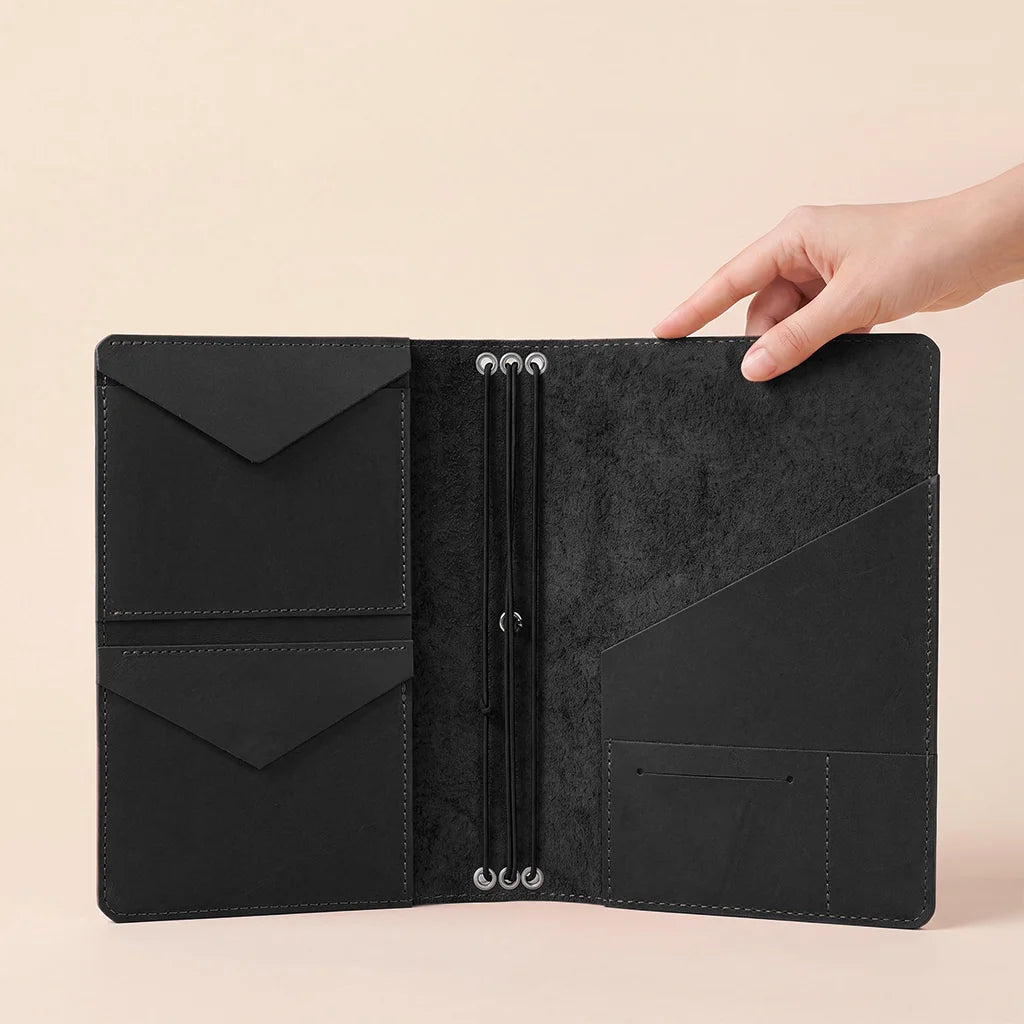 Genuine leather refillable cover with elegant stitching and spacious interior organization features.