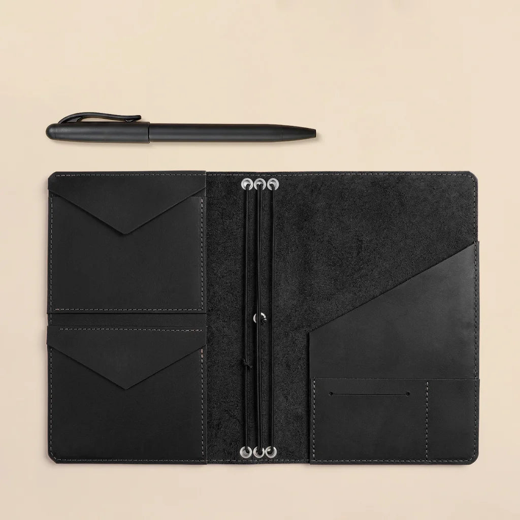 Handmade leather journal organizer with refillable elastic bands and convenient inside pockets.