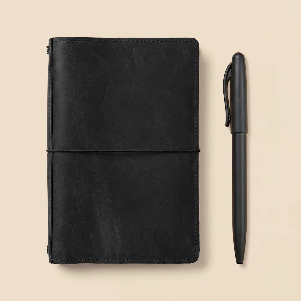 Leather planner cover with practical elastic notebook holders and spacious interior organization pockets