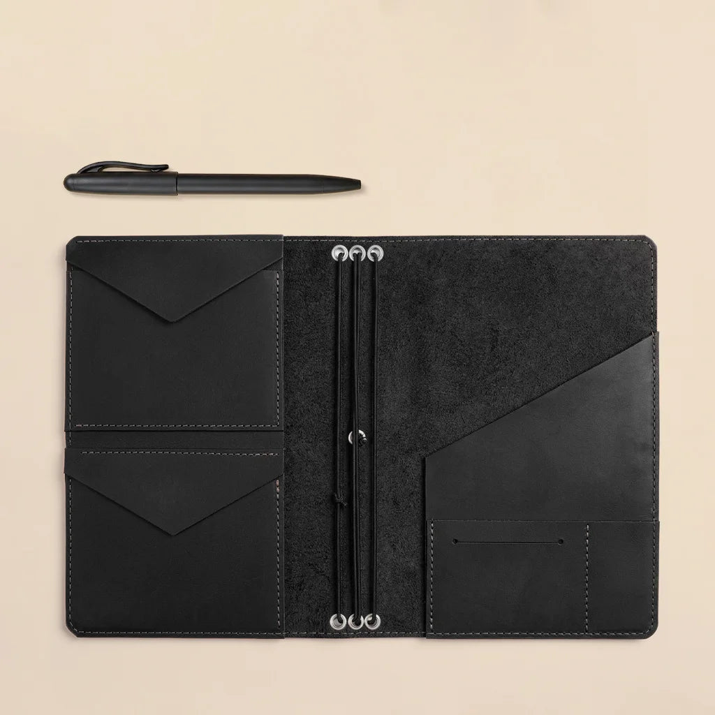 Leather notebook organizer combining elegant craftsmanship with refillable elastic insert functionality.