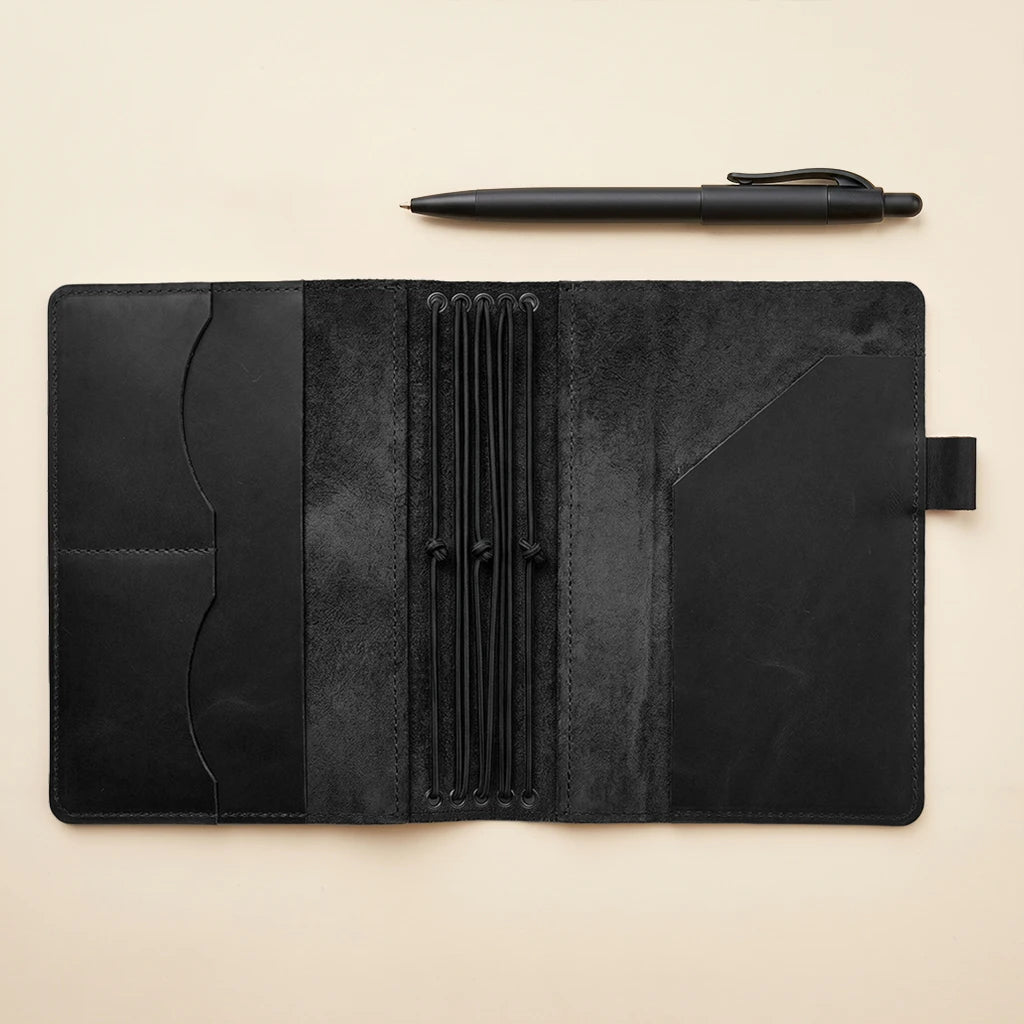 Leather journal cover with refillable inserts, pockets, and elastic closures