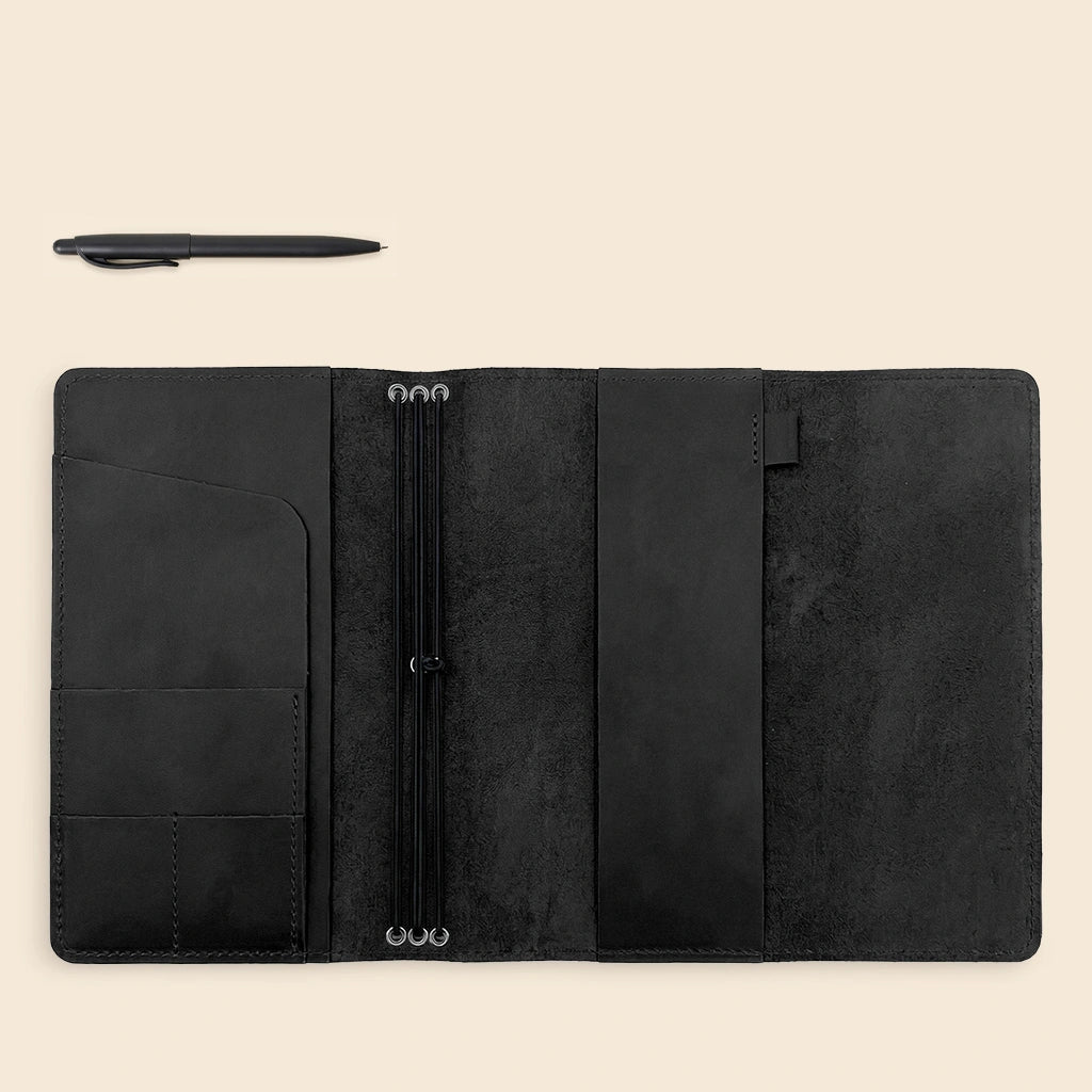 Leather planner organizer with handcrafted finish, notebook elastics, and convenient storage pockets.