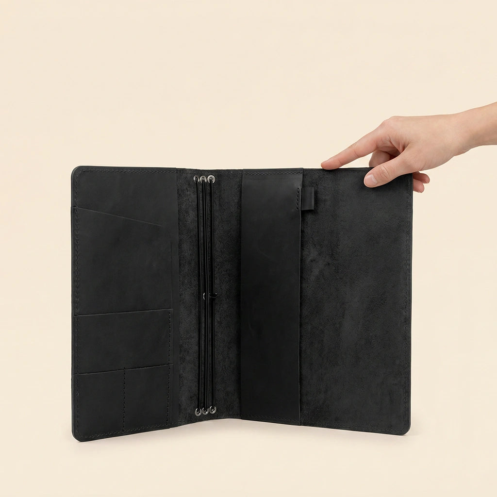 Natural leather notebook organizer featuring refillable journal support and everyday storage solutions.