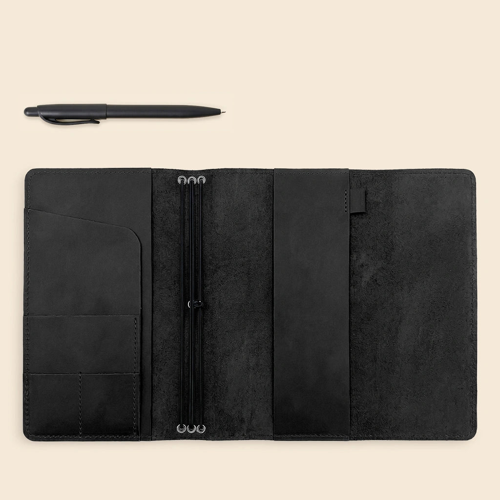 Leather notebook holder featuring organized storage and premium natural leather craftsmanship.