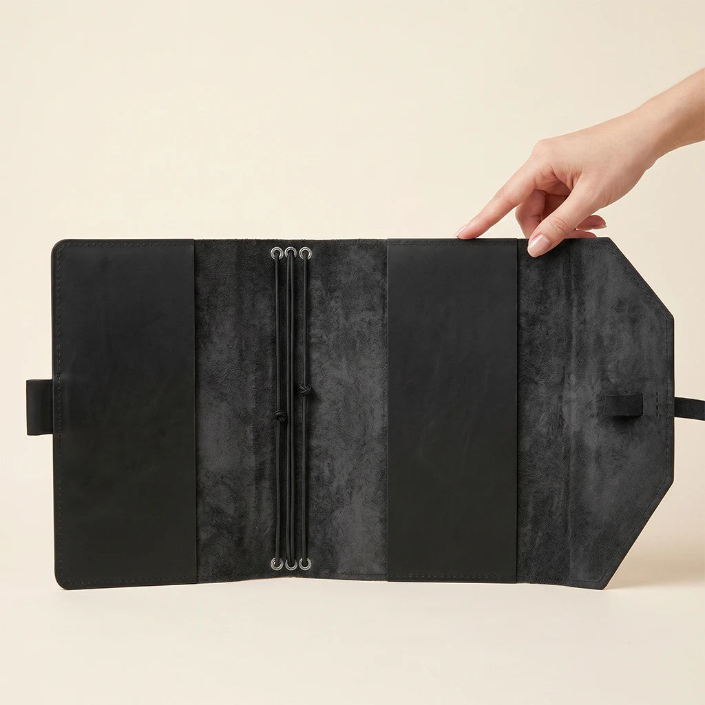 Hand-finished leather notebook wrap balancing elegance, function, and portability.