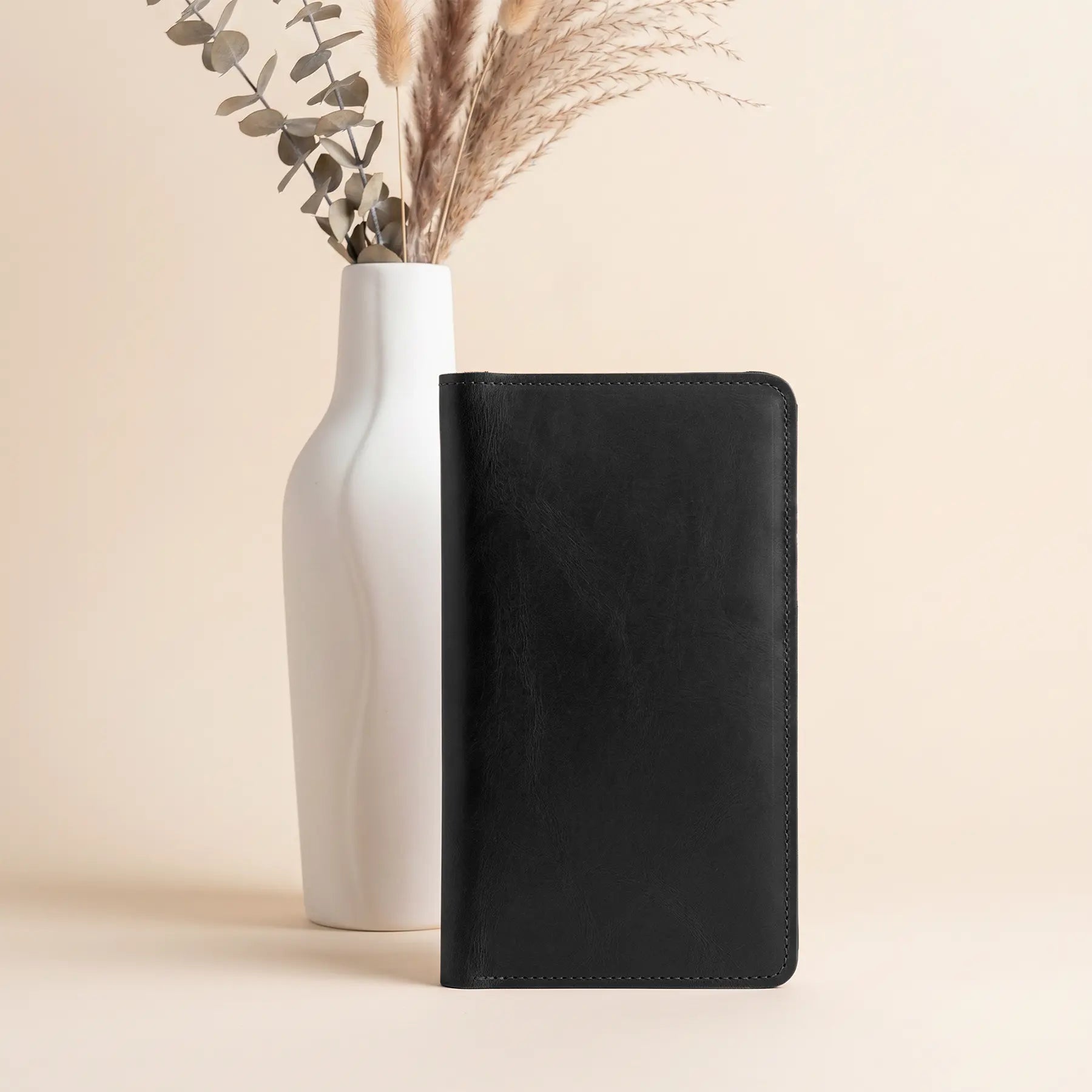 Genuine leather snap wallet handcrafted for secure organization of cash, cards, and everyday essentials.