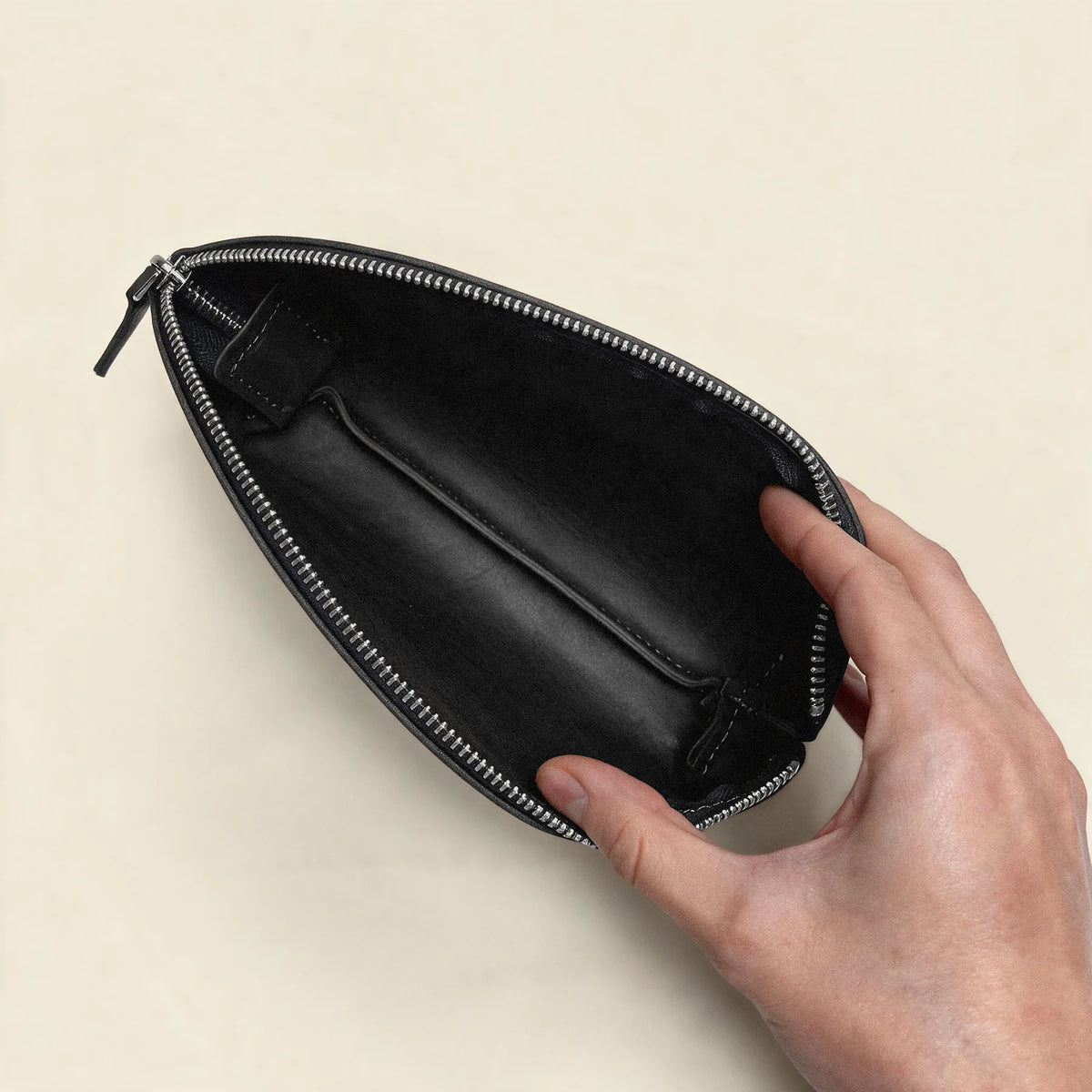 Premium genuine leather makeup pouch with smooth zipper closure and practical design