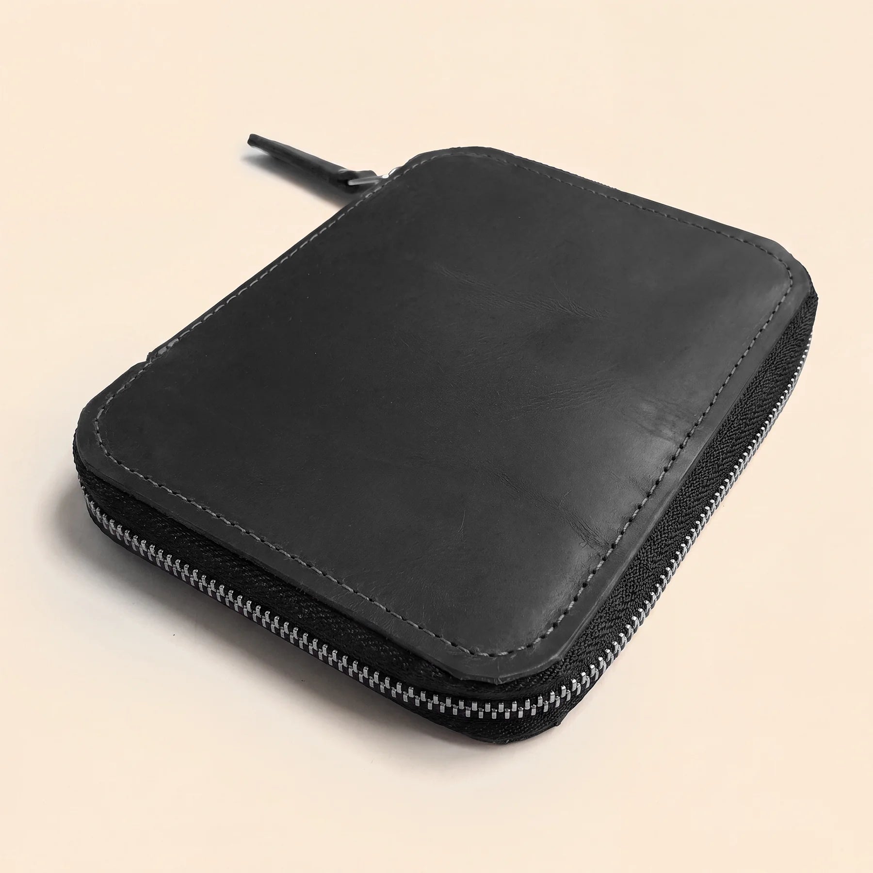 Leather zippered pen holder for fountain pens, pencils, and everyday stationery.