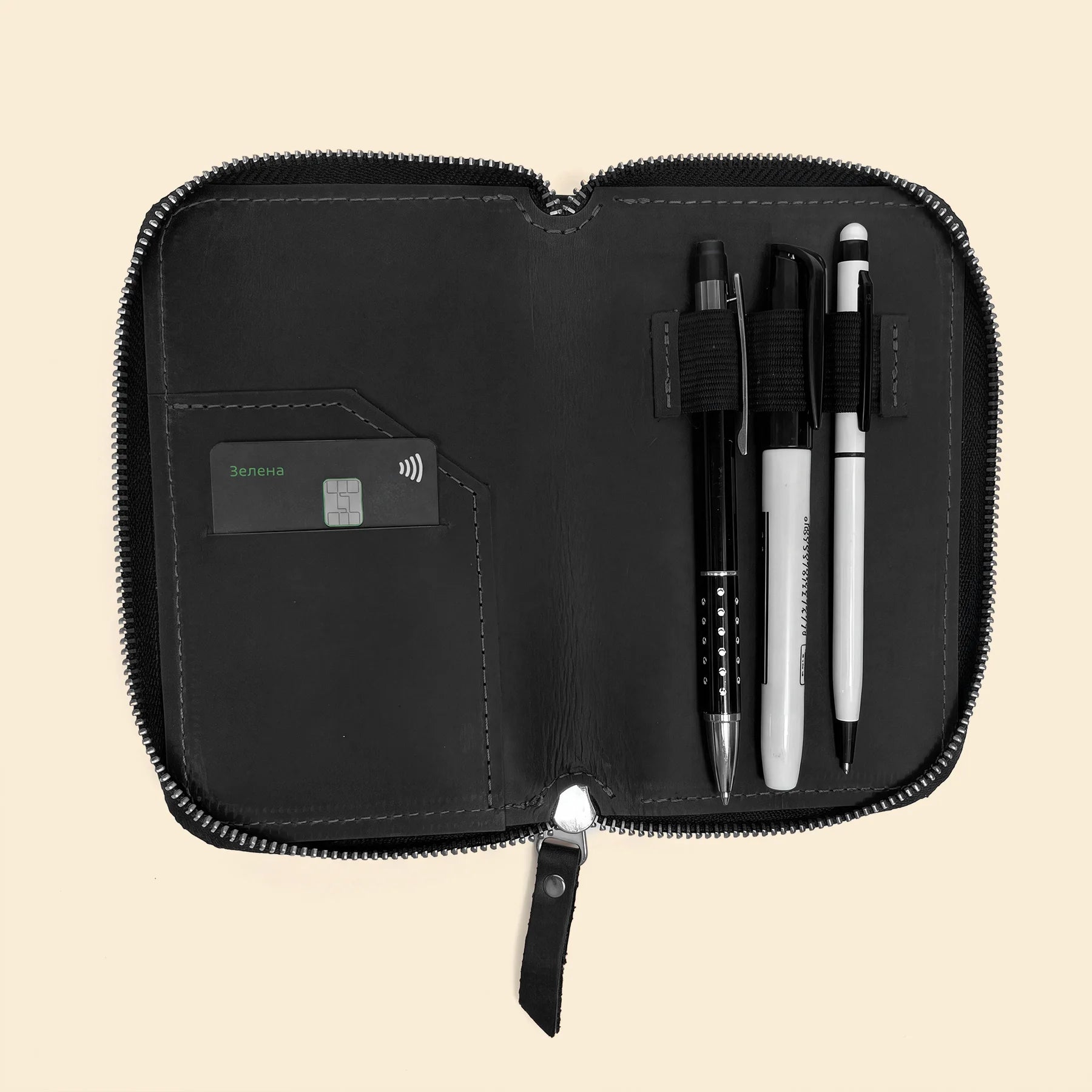 Handmade leather pen storage pouch featuring durable zipper and refined craftsmanship.