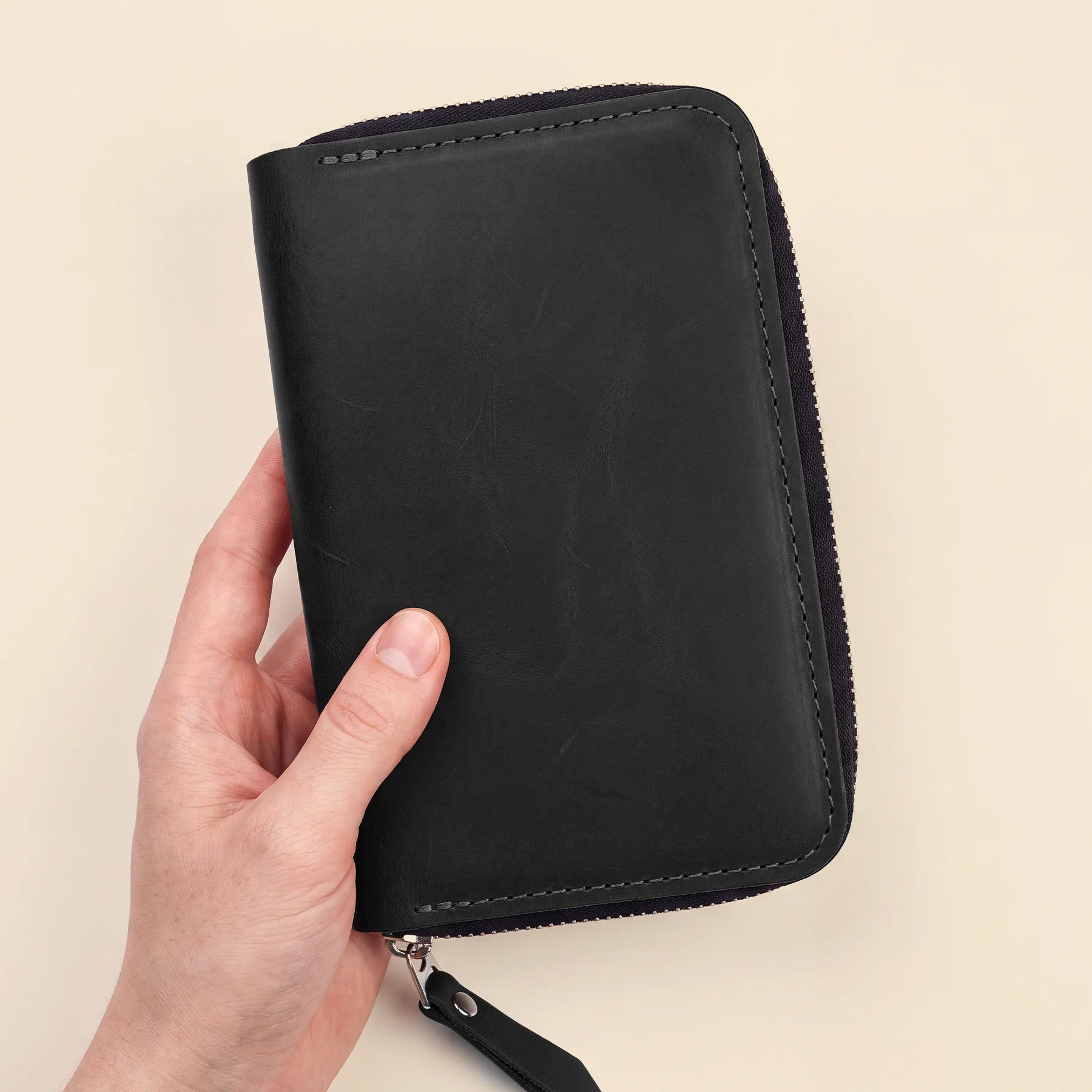 Compact leather zipper organizer for fountain pens, pencils, and stationery essentials.