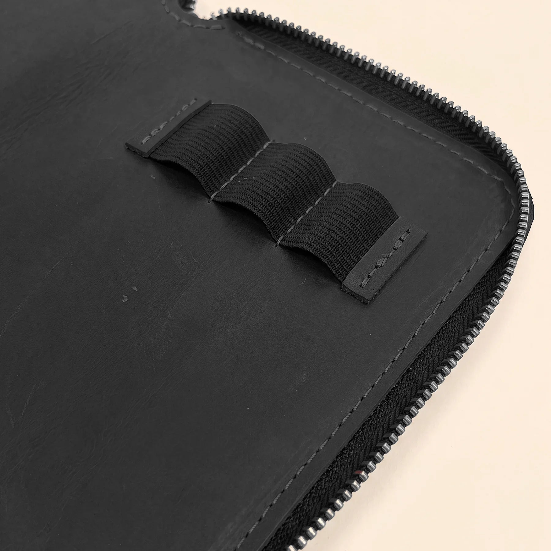 Premium handcrafted leather pen case with secure zipper and classic timeless design.